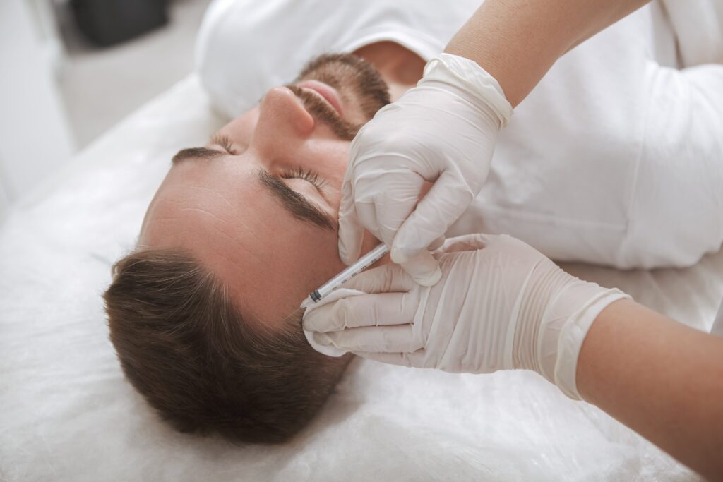 Man receiving hair loss injections treatment