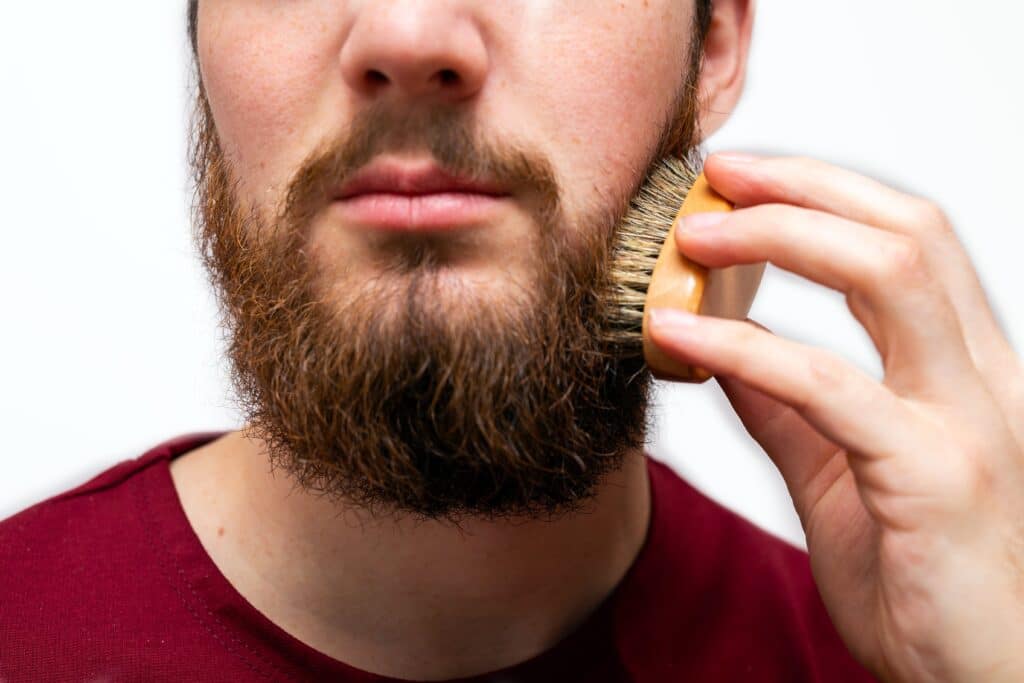 Man combing his beard