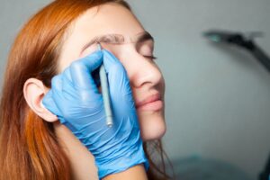 Woman undergoing sparse eyebrows treatment