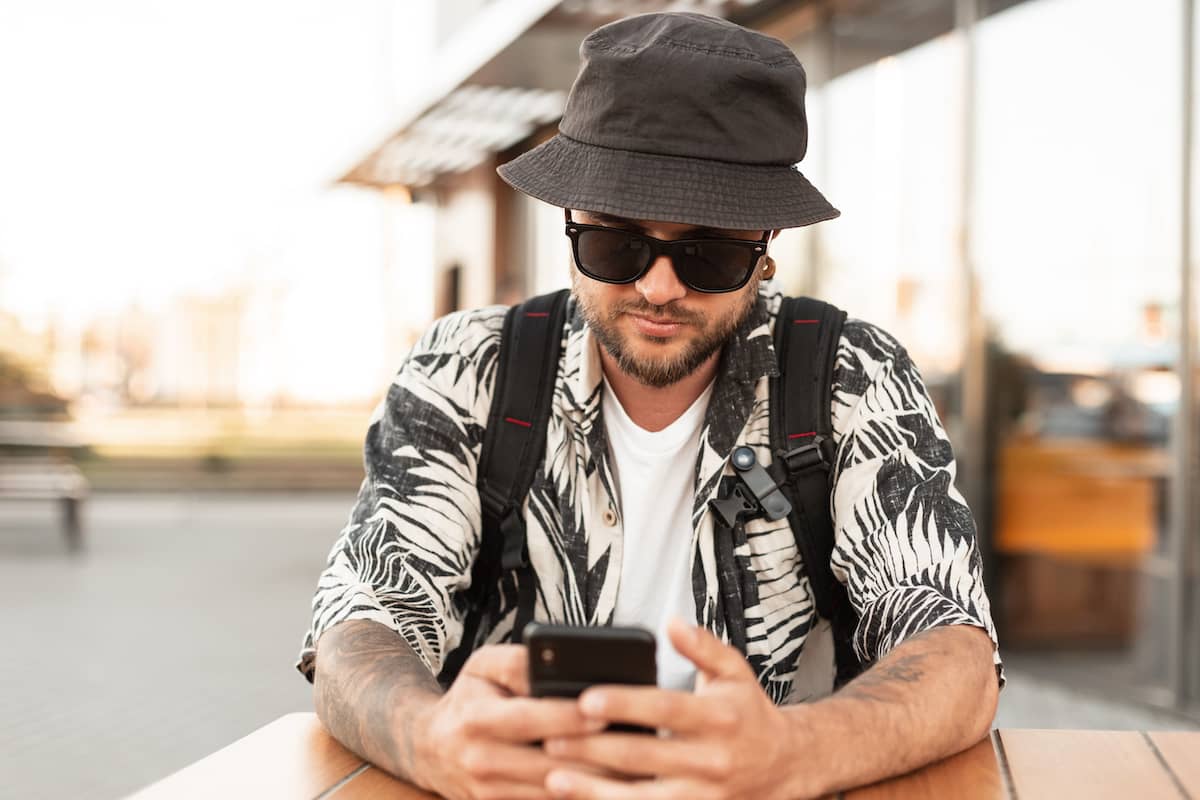 Man wearing hat after hair transplant