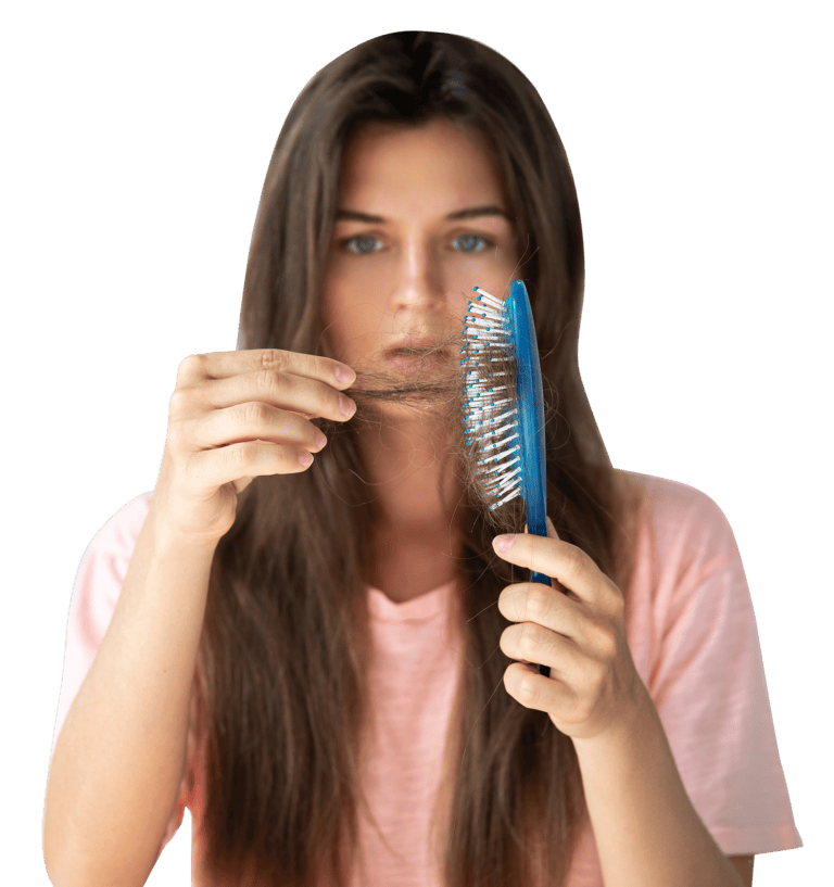 Woman looking at hair in her hair brush